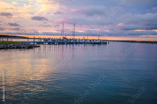 Sailing Sunset Sky Background.. Michigan marina along the Great Lakes coast with a beautiful sunset sky. Cheboygan, Michigan.  © ehrlif