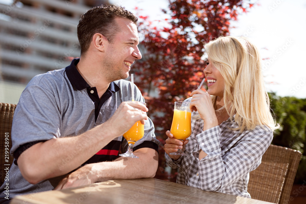 happy couple enjoying a coffee at the coffee shop,outdoor happy couple enjoying a coffee at the coffee shop,outdoor