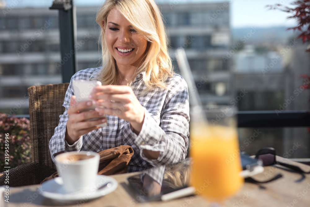 woman using smart phone in cafe woman using smart phone in cafe