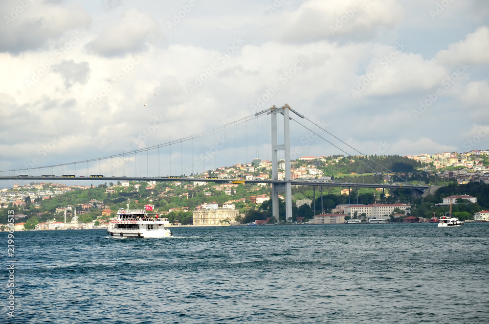Bosphorus Bridge on a sunny day with background cloudy  sky in Istanbul, Turkey. 