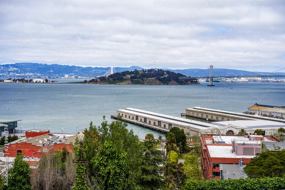 SAN FRANCISCO, CALIFORNIA, USA - MAY 15, 2018: View from the hill to the city port and Bay Bridge