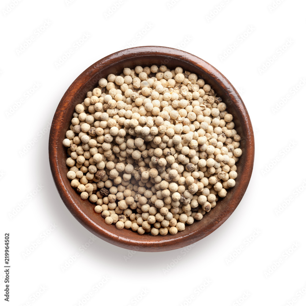 white pepper in a wooden bowl, isolated on white white pepper in a wooden bowl, isolated on white