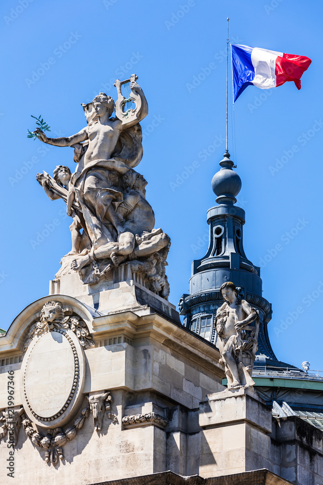 Obraz premium French flag waving on top of the Grand Palais. Paris, France