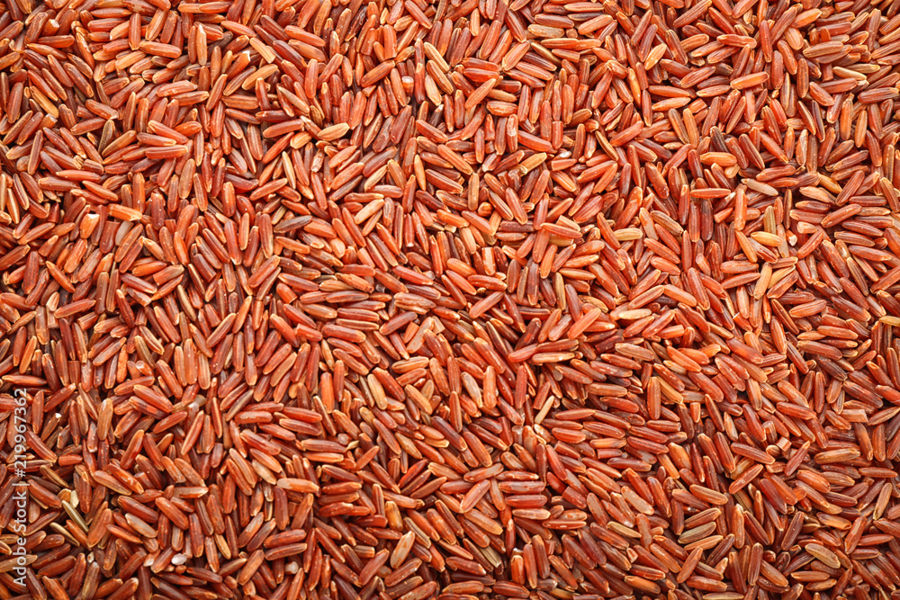 Fototapeta premium Raw red rice as background