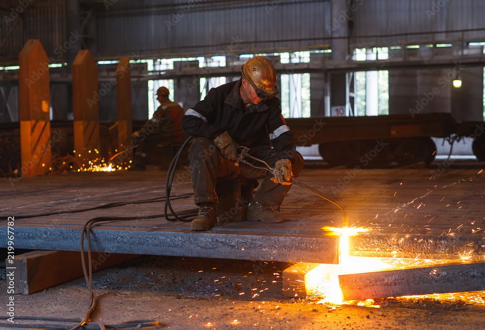 Industrial Worker at the factory welding closeup