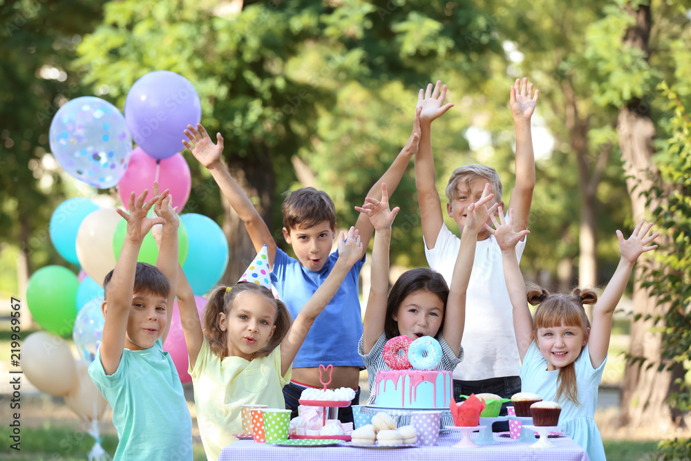 Cute little children celebrating Birthday outdoors - obrazy, fototapety, plakaty 