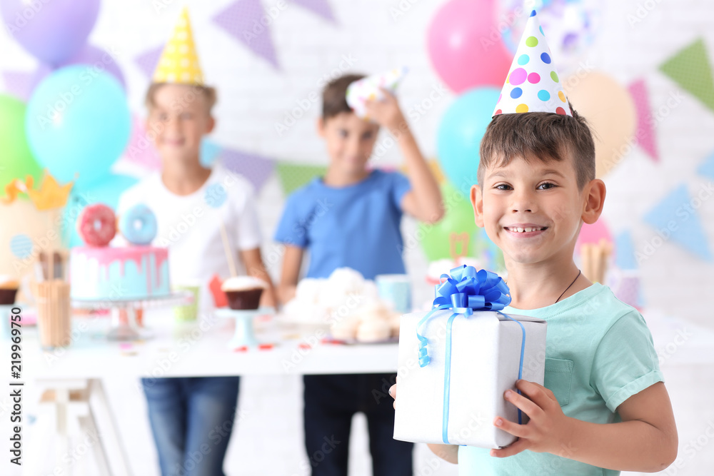 Cute little boy with Birthday gift at party Cute little boy with Birthday gift at party