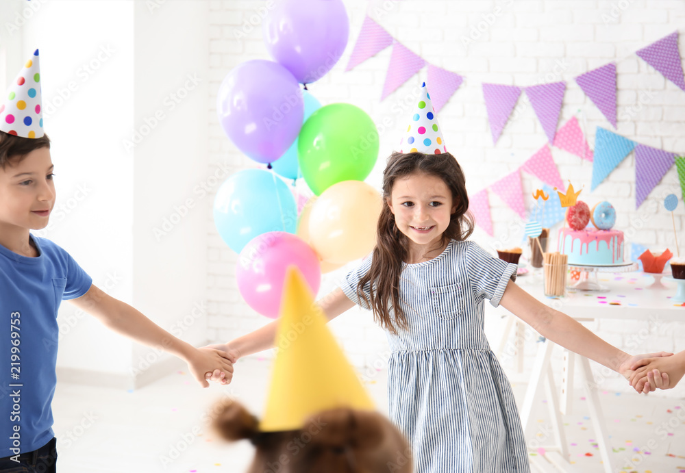 Fototapeta premium Cute little children celebrating Birthday at home