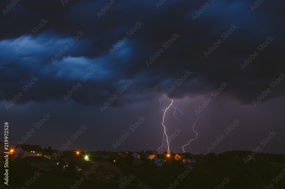 Summer thunderstorm and lightnings