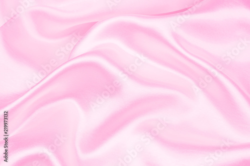 Smooth elegant pink silk or satin texture can use as abstract background. soft focus