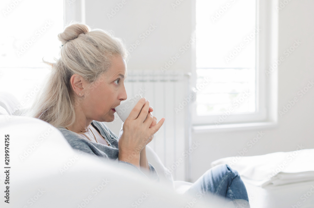 Senior woman drinking coffe Senior woman drinking coffe
