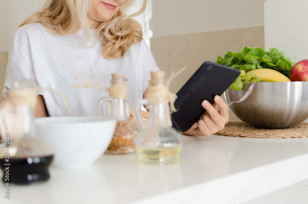 Woman searching for recepis Woman searching for recepis