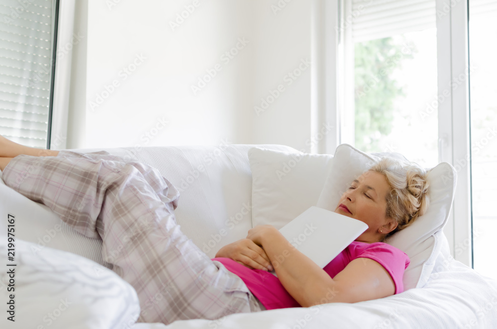 Woman taking a nap while reading Woman taking a nap while reading