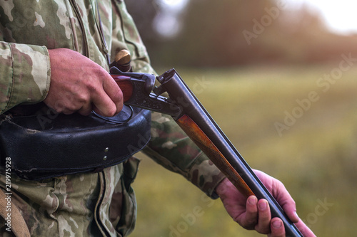 Hunting rifle in the hands of a hunter