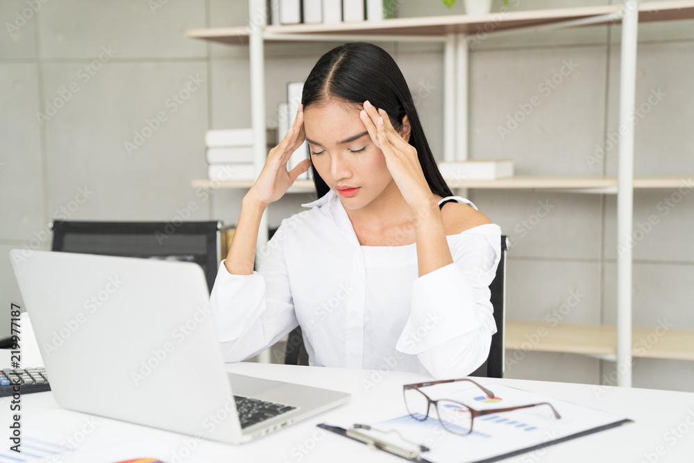 Business woman ired from work in the office Business woman ired from work in the office