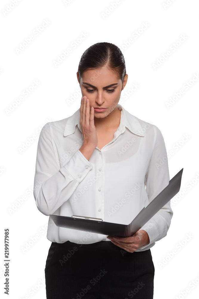 Concerned businesswoman learns a plan Concerned businesswoman learns a plan