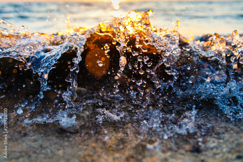 Wave splashing on the sea shore close-up © korsarid