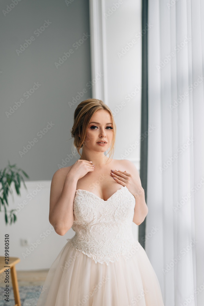 Bride with a big breast in a wedding dress Stock Photo | Adobe Stock