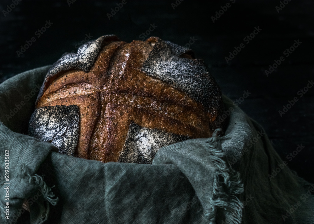 malt rye bread with poppy seeds dark photo
