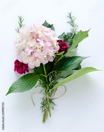 Bouquet of hydrangeas and dahlias on white background. Top view.