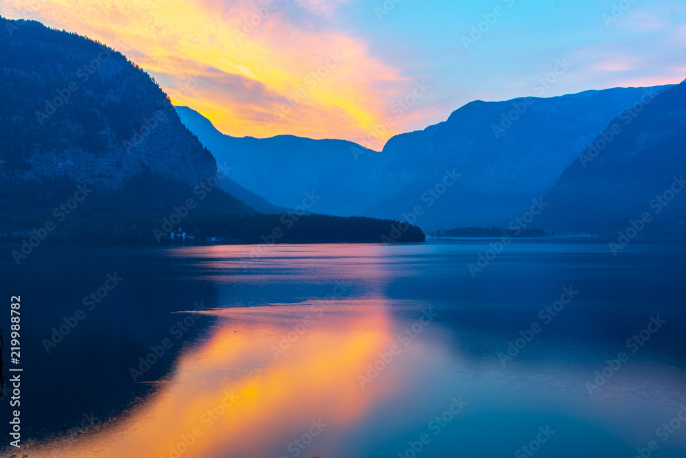 Sunrise over lake Hallstatter, surrounded by the Alps