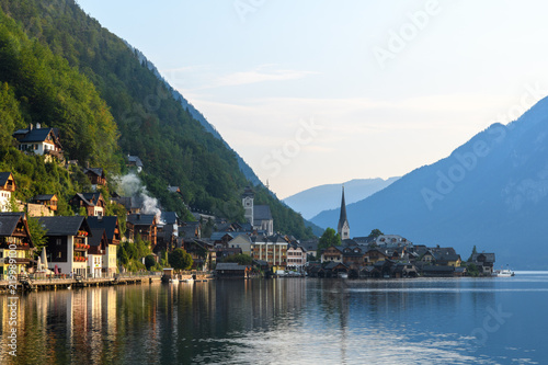View of the Alpine town of Hallstatt on the shore of a mountain lake at dawn