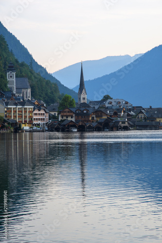 View of the Alpine town of Hallstatt on the shore of a mountain lake at dawn