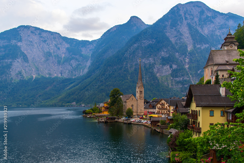 View of the Alpine town of Hallstatt on the shore of a mountain lake at sunset