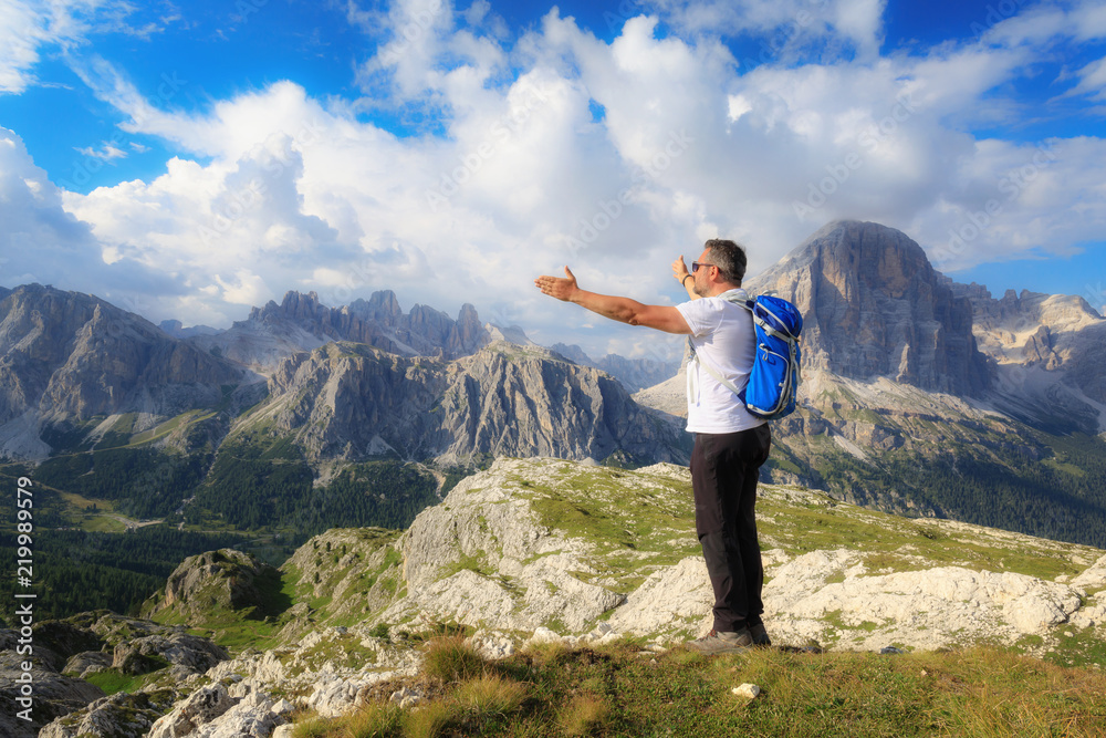 Man admires the mountain landscape of the Alpine peaks.