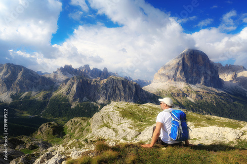 Man admires the mountain landscape of the Alpine peaks.