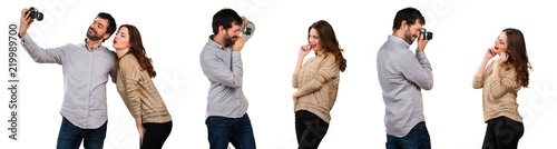 Set of Young couple photographing