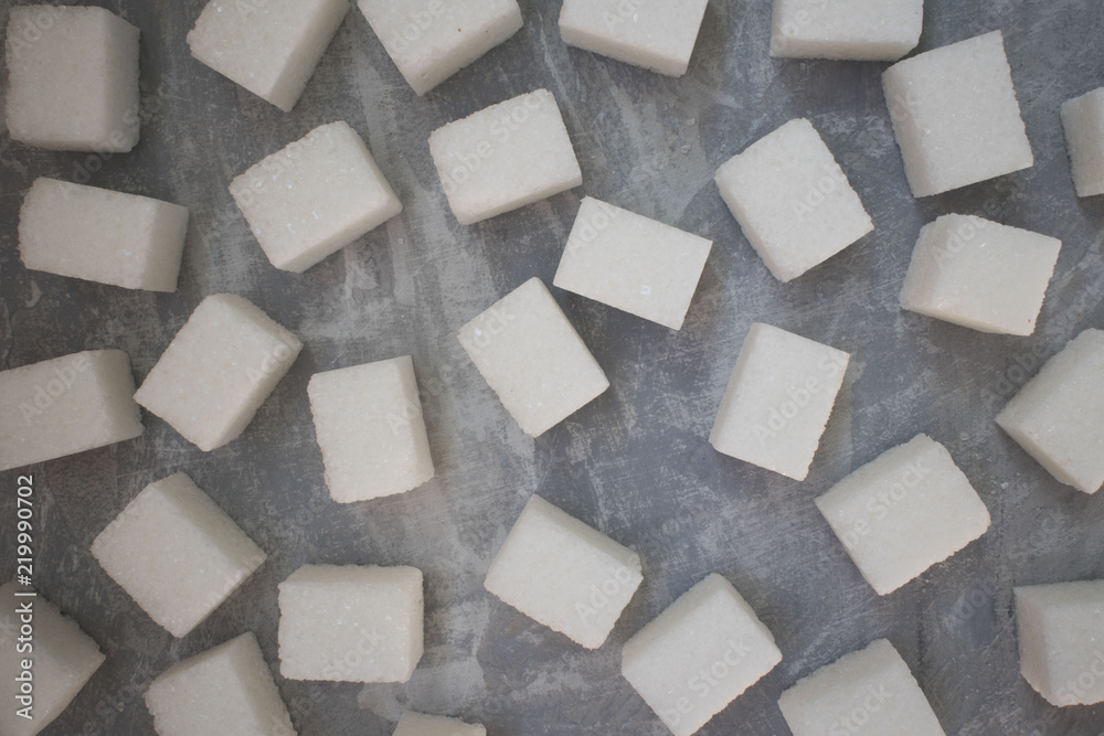 sugar cubes on concrete background. Top view of white sugar . Sugar with copy space. Top view or flat lay sugar cubes on concrete background. Top view of white sugar . Sugar with copy space. Top view or flat lay