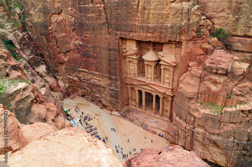 The temple-mausoleum of Al Khazneh in the ancient city of Petra in Jordan. Designation as a UNESCO World Heritage Site. Copy space top view landscape background.