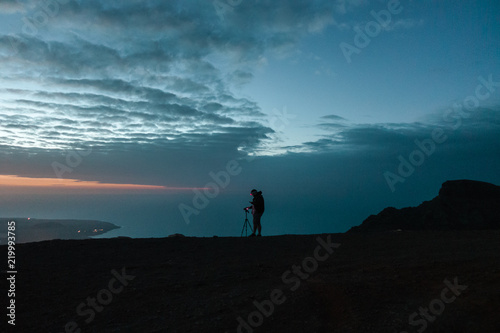A photographer taking photos near Famara, Lanzarote, Spain