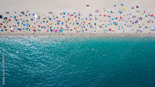 Aerial view of crowded sandy beach line