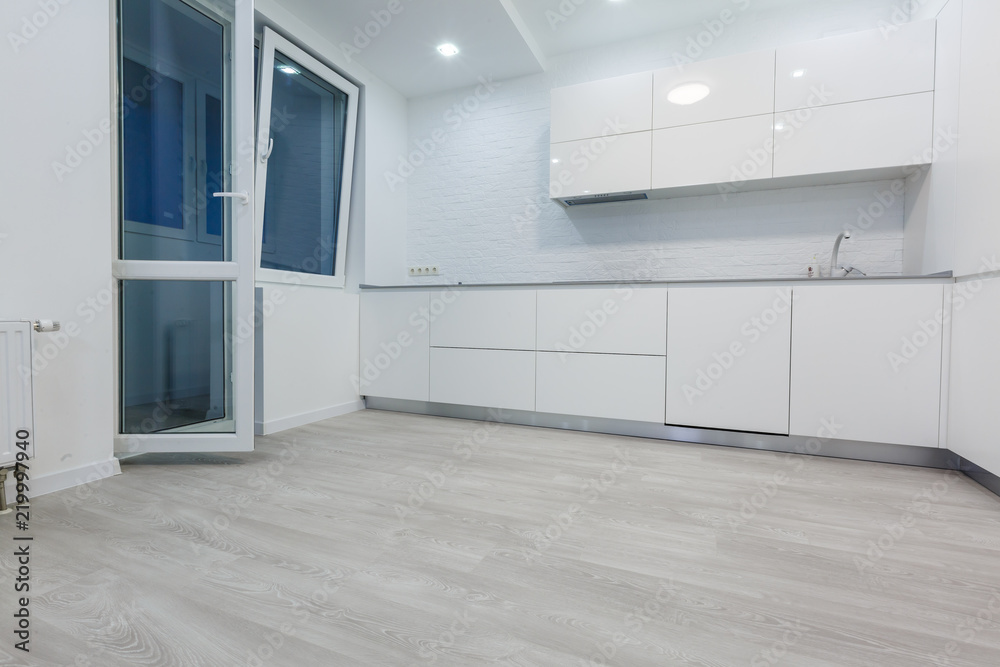 Obraz premium Detail of a fancy kitchen counter top and cupboards panorama