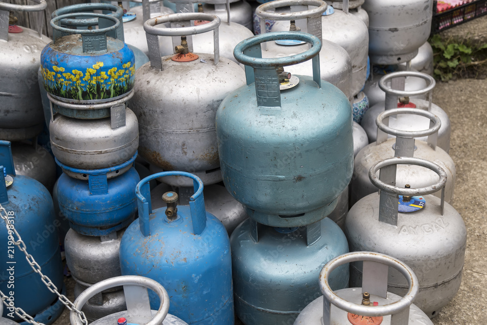 blue and grey Aygaz, Ipragaz gas cylinders in the shop. blue and grey Aygaz, Ipragaz gas cylinders in the shop.