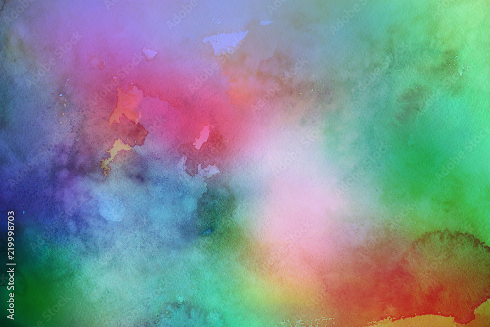 Colorful watercolor ombre leaks and splashes texture on white watercolor paper background. Natural organic shapes and design.