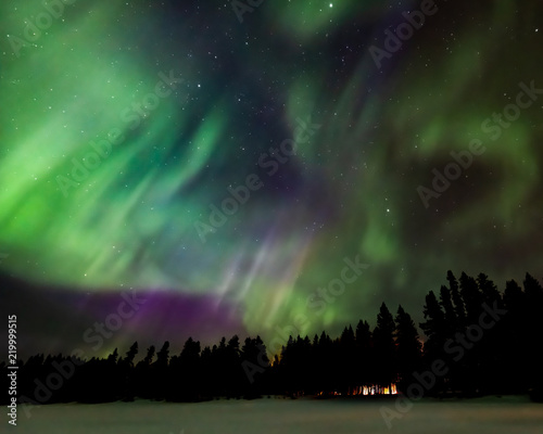 Aurora over cabin in the forest © Craig Taylor Photo