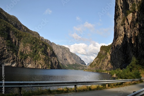 road in valley with river and mountains in Norway