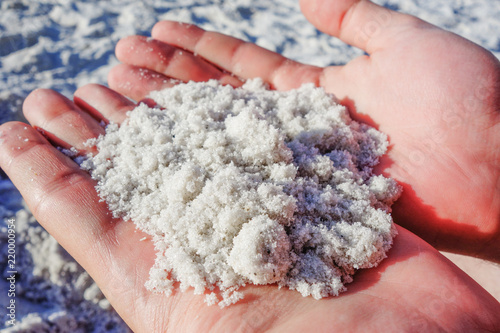White sand in hands.
