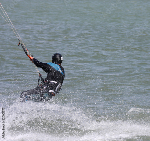 kitesurfer riding board