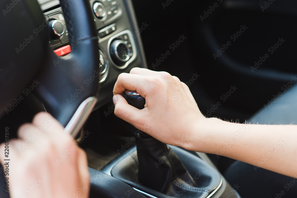 Picture of female hands and gear lever