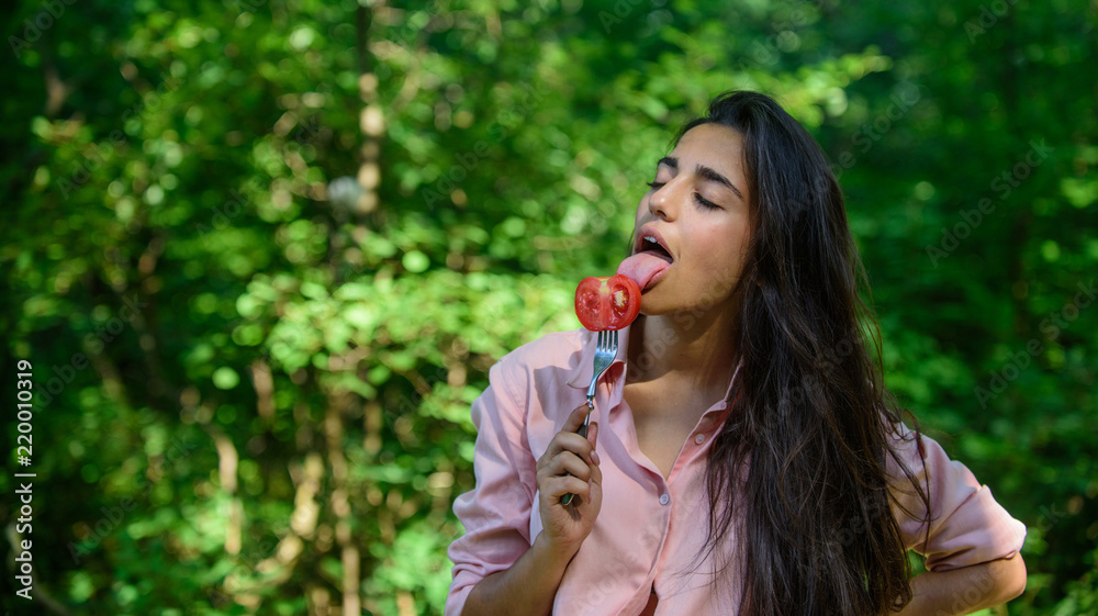 Seductive appetite. Her appetite is sexy. Woman full of desire hungry eating tomato. Girl holds fork with juicy ripe tomato. Girl seductive eats red vegetable. Lady attractive brunette eats tomato Seductive appetite. Her appetite is sexy. Woman full of desire hungry eating tomato. Girl holds fork with juicy ripe tomato. Girl seductive eats red vegetable. Lady attractive brunette eats tomato
