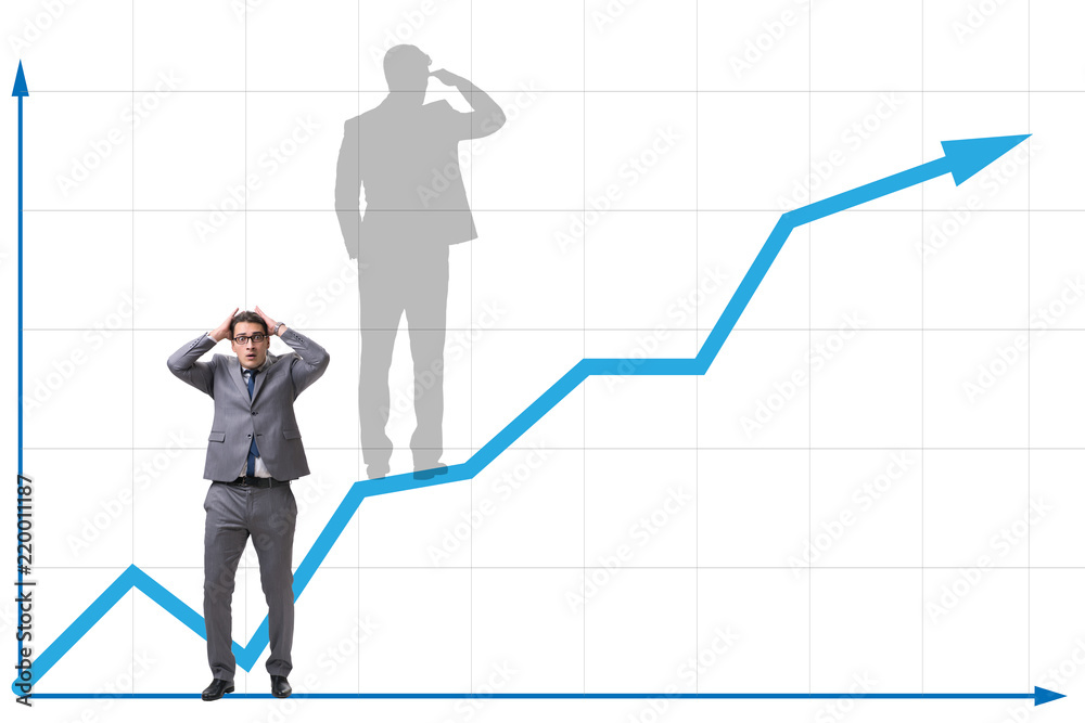 Businessman and his shadow in business concept Businessman and his shadow in business concept