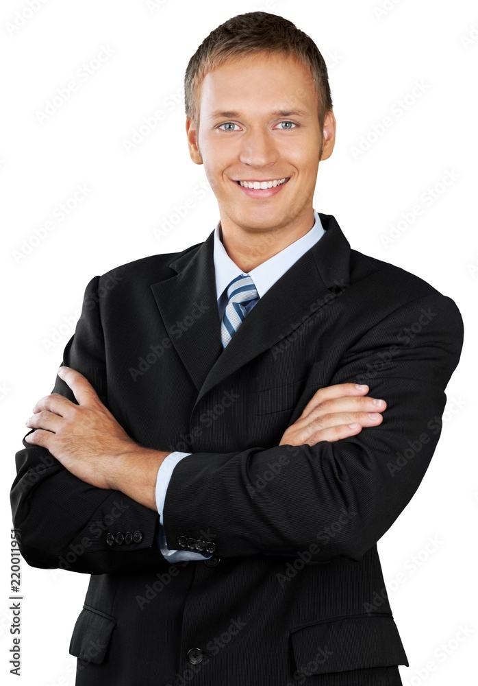 Professional looking man with his arms crossed wearing a suit Professional looking man with his arms crossed wearing a suit