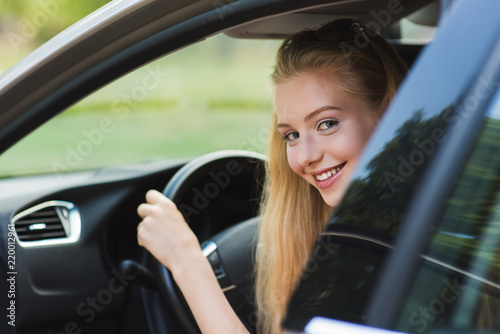 Very happy young blondy girl driving car © o_lypa