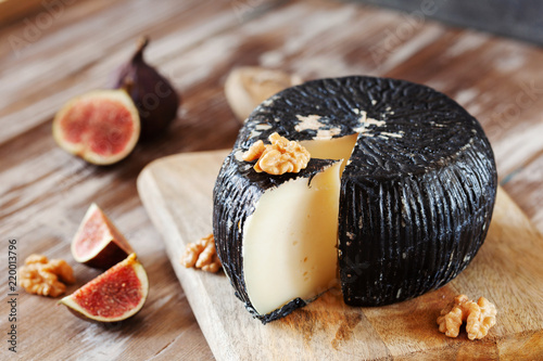 Greek graviera cheese decorated with figs and walnut