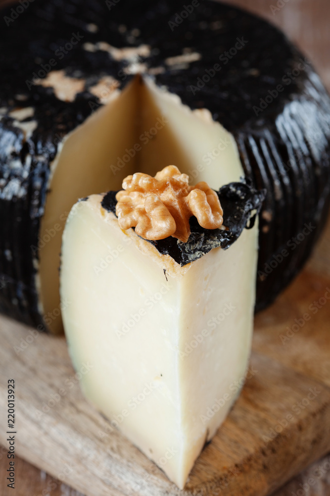 Greek graviera cheese decorated with walnut