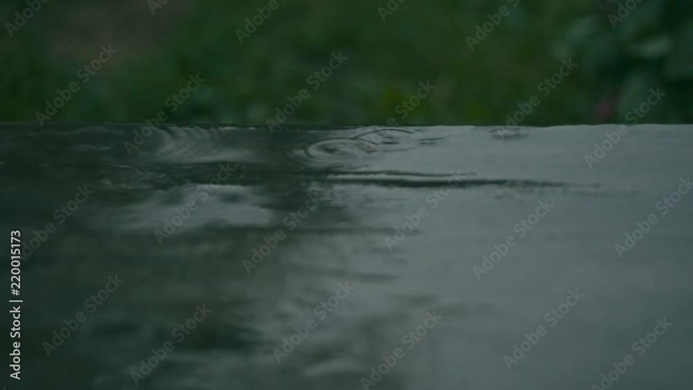 Drops of rain on concrete floor, shallow depth of field Drops of rain on concrete floor, shallow depth of field